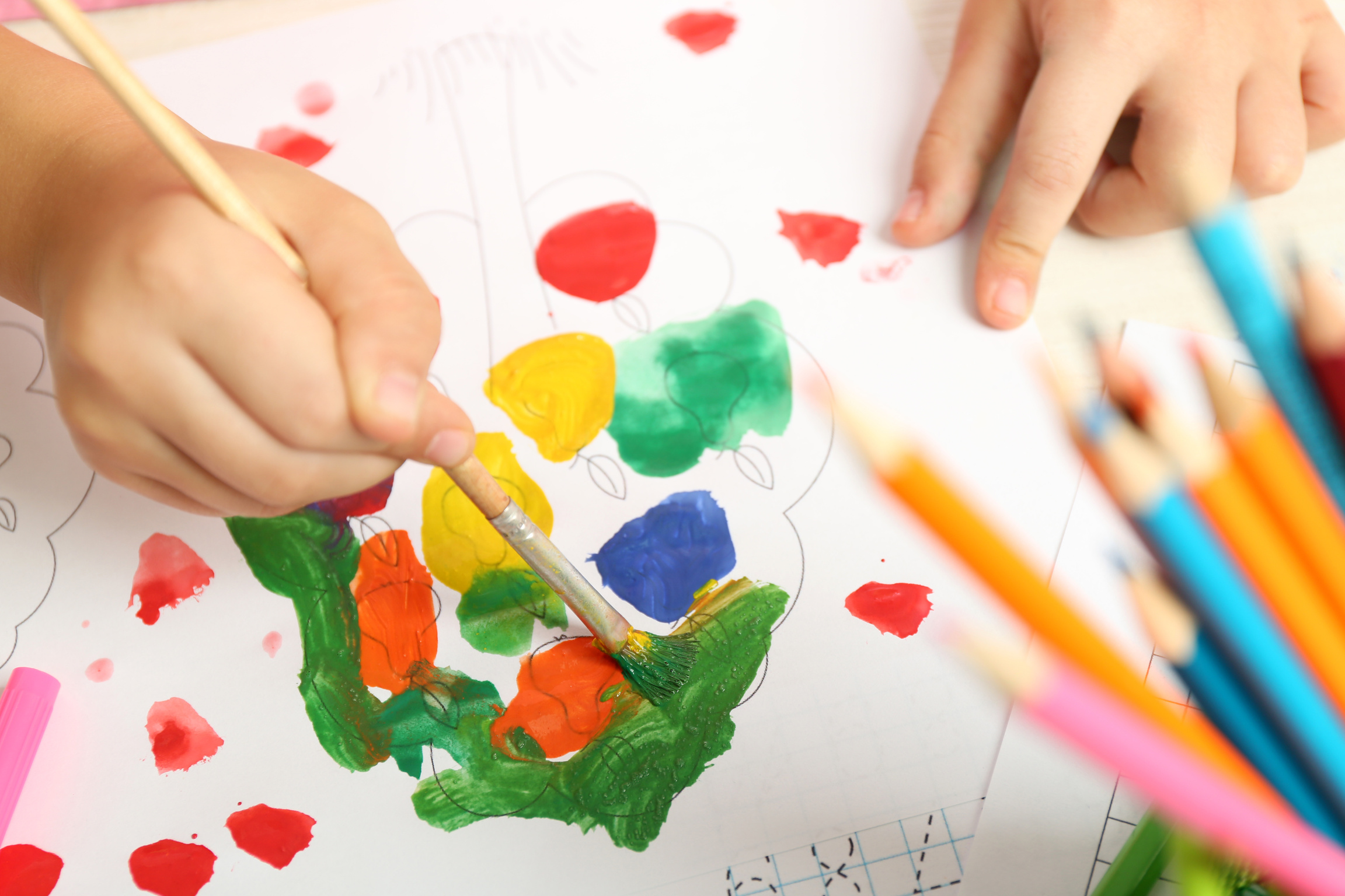 Child Painting on a Piece of Paper